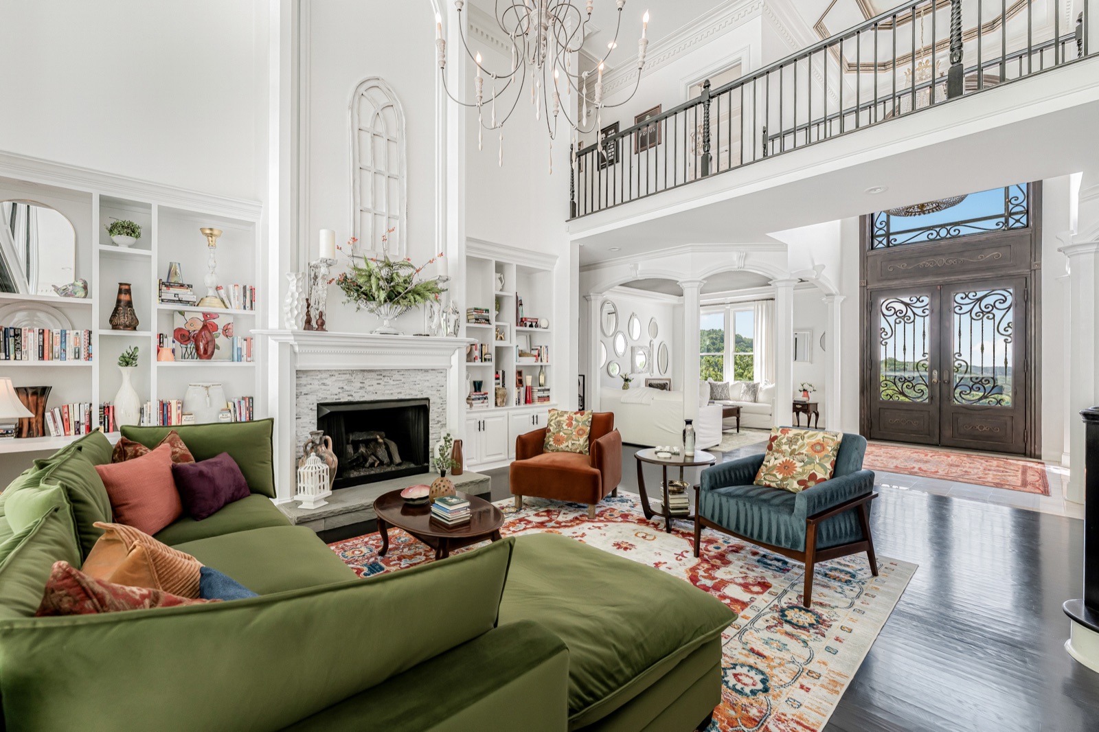 The great room, wide: the 1897 Baldwin grand, fireplace, and oversized windows.